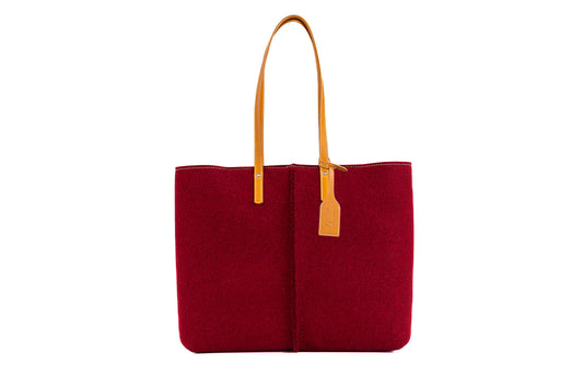 Tote Bag Large Bourdeaux made of high-quality Merino wool felt and vegan leather, featuring two large internal pockets. Soft, sturdy, and roomy, perfect for work or a day out. Easy access with internal magnetic buttons and a large opening. Handmade in Italy, comes with a natural cotton dust bag. - Lefrac